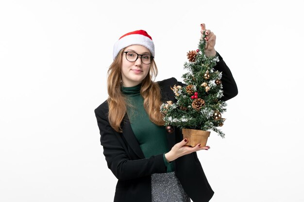 Close up on young pretty woman wearing Christmas hat isolated