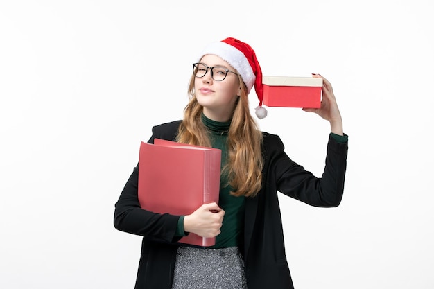 Close up on young pretty woman wearing Christmas hat isolated