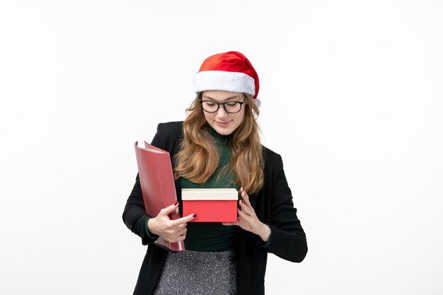 Close up on young pretty woman wearing Christmas hat isolated