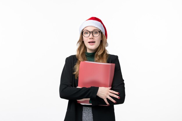 Close up on young pretty woman wearing Christmas hat isolated