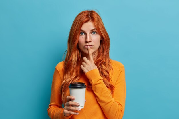 Close up on young redhead woman gesturing