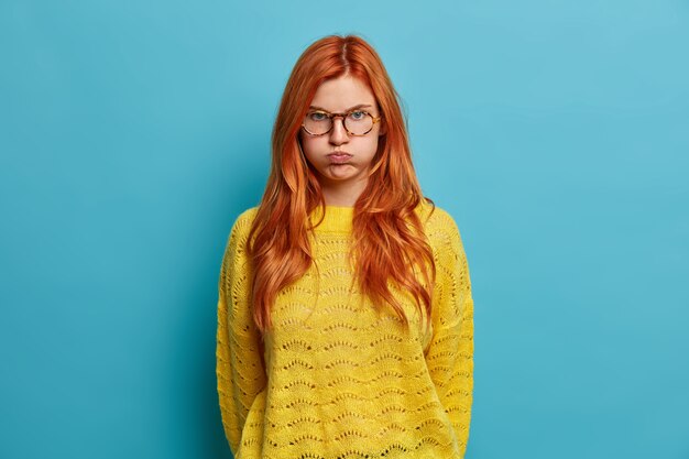 Close up on young redhead woman gesturing