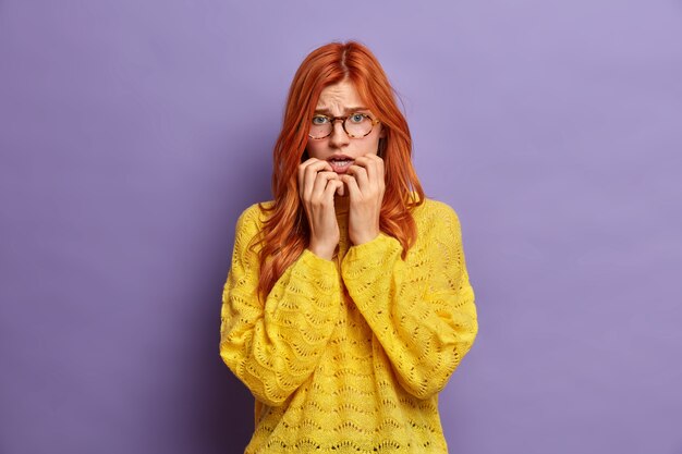 Close up on young redhead woman gesturing