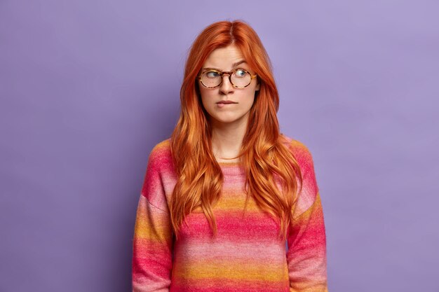 Close up on young redhead woman gesturing