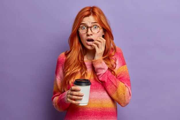 Close up on young redhead woman gesturing