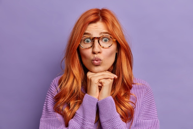 Close up on young redhead woman gesturing