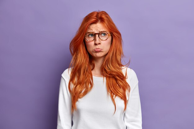 Close up on young redhead woman gesturing