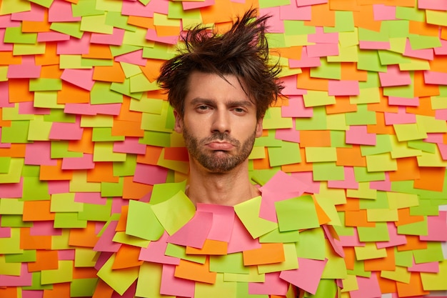 Free photo close up on young student surrounded by sticky notes