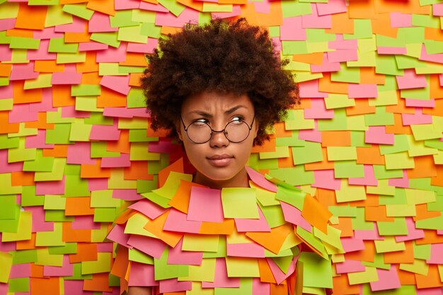 Close up on young student surrounded by sticky notes