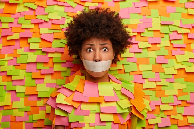 Close up on young student surrounded by sticky notes