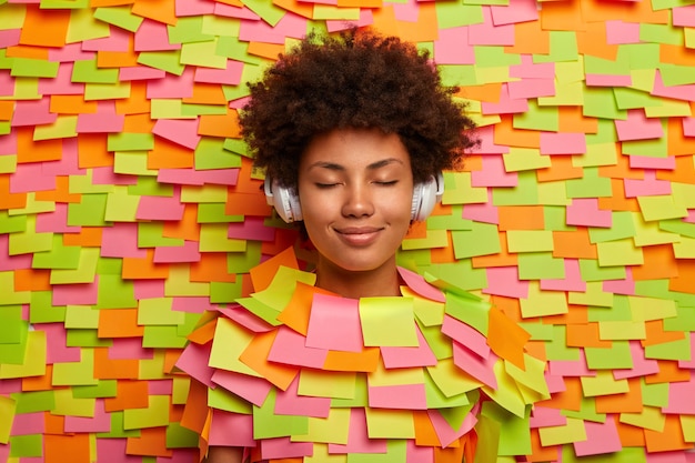 Close up on young student surrounded by sticky notes