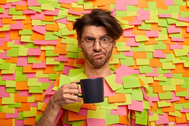 Close up on young student surrounded by sticky notes