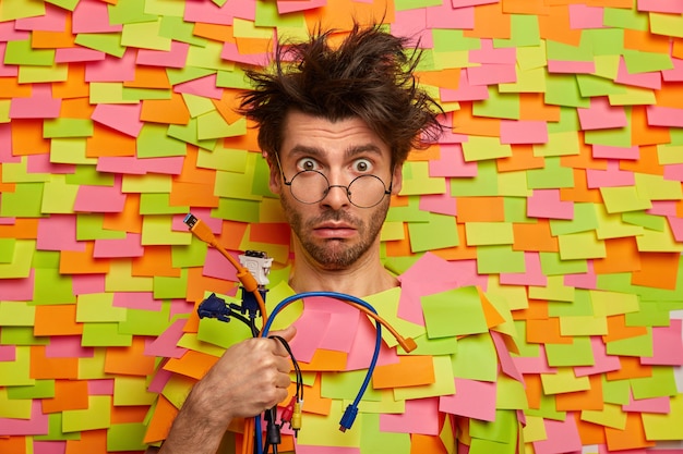 Close up on young student surrounded by sticky notes