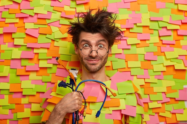 Free photo close up on young student surrounded by sticky notes