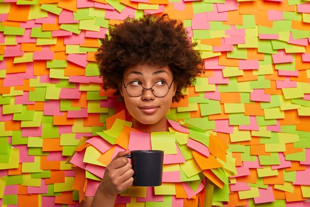 Close up on young student surrounded by sticky notes