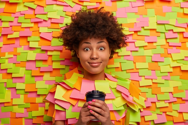 Close up on young student surrounded by sticky notes