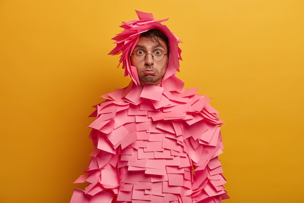 Free photo close up on young student surrounded by sticky notes