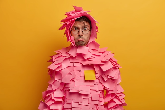 Free photo close up on young student surrounded by sticky notes