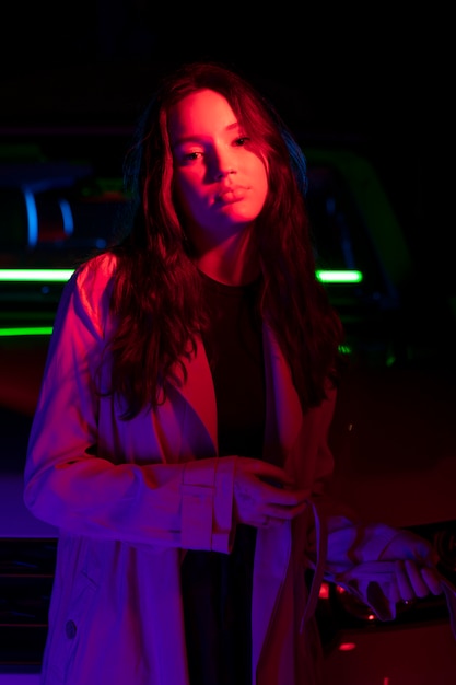 Close up on young woman posing in dramatic light