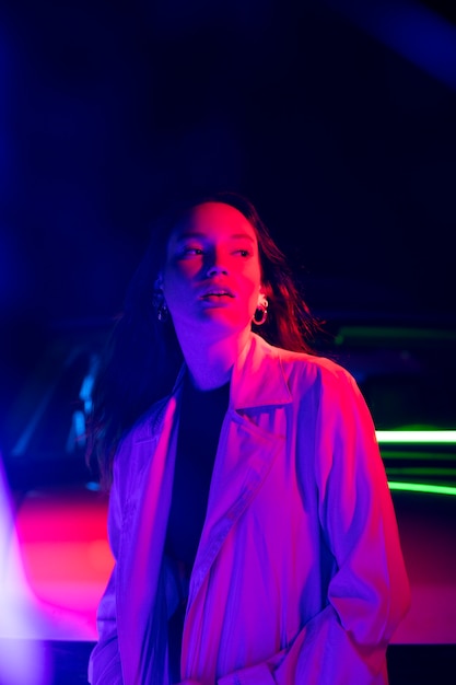 Close up on young woman posing in dramatic light