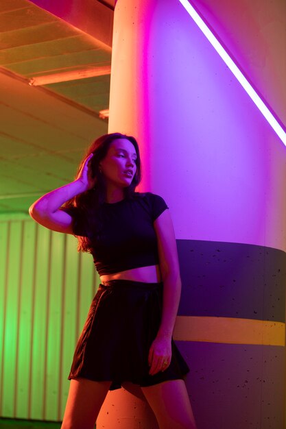 Close up on young woman posing in dramatic light