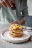 Free photo close up on young woman preparing food for eating