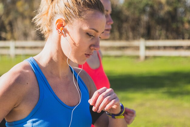 Close-up of young woman running