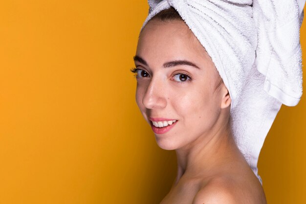 Close-up young woman smiling at camera