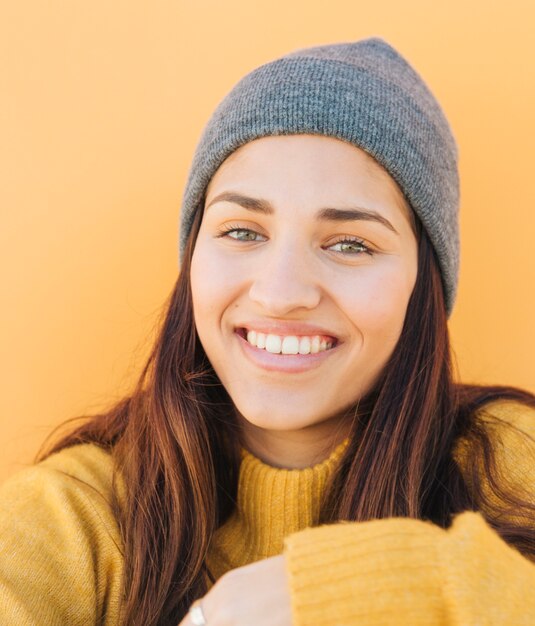 close-up of a young woman wearing knitted hat