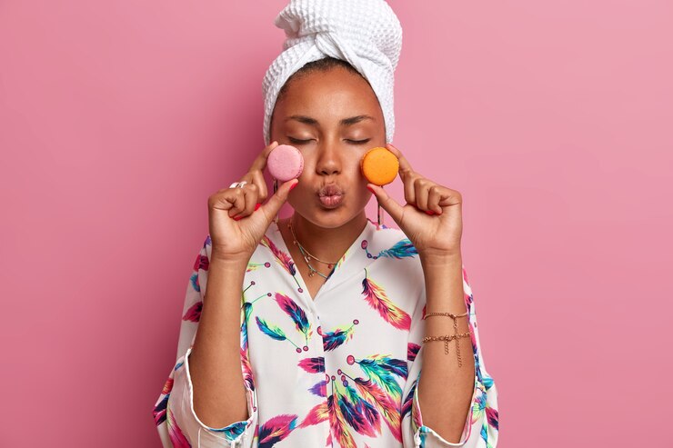 Free Photo close up on young woman wearing robe and wrapped towel on head