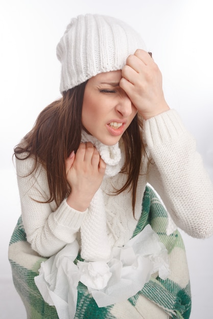 Close-up of young woman with a cold