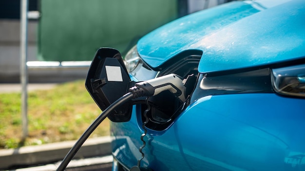 Close view of a charger plugged into an electric car