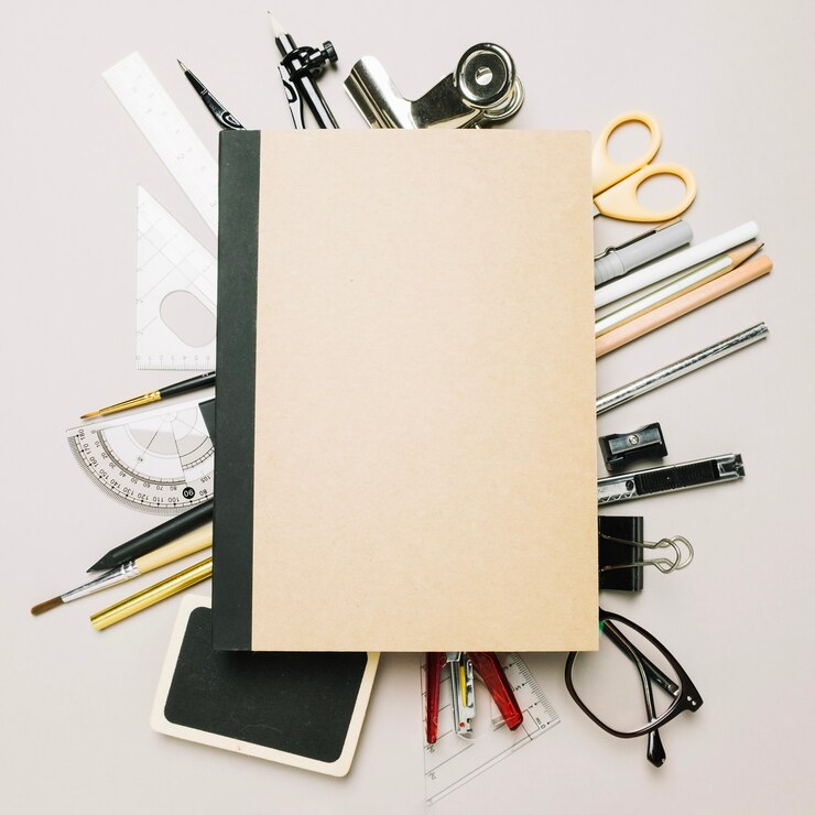 Free Photo closed notebook on office supplies