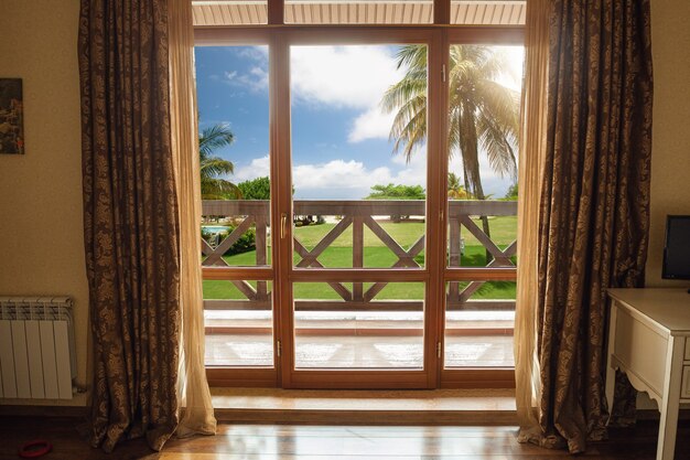 Closed window and beautiful picture outside, nature view, resort and resting.