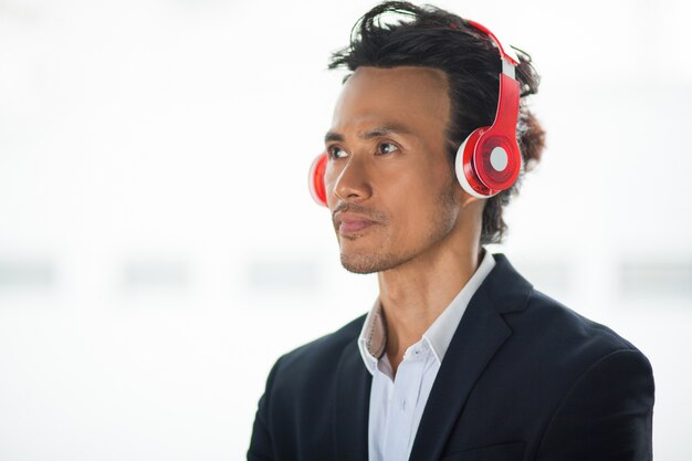 Closeup of Asian Man Enjoying Listening to Music
