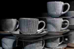 Free photo closeup beautiful grey ceramic cups with patterns