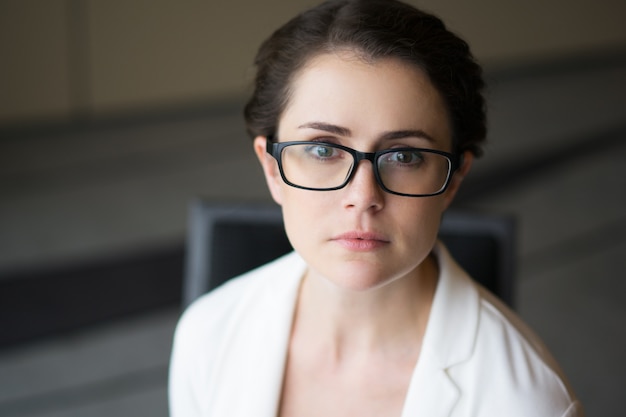 Closeup of Beautiful Sincere Woman in Glasses