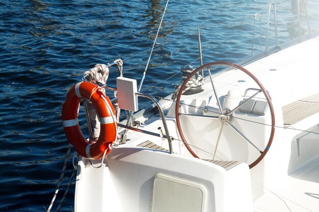 Closeup of Beautiful Yacht Rudder. Daylight. Horizontal. Sea Background.