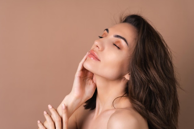 Closeup beauty portrait of a topless woman with perfect skin and natural makeup