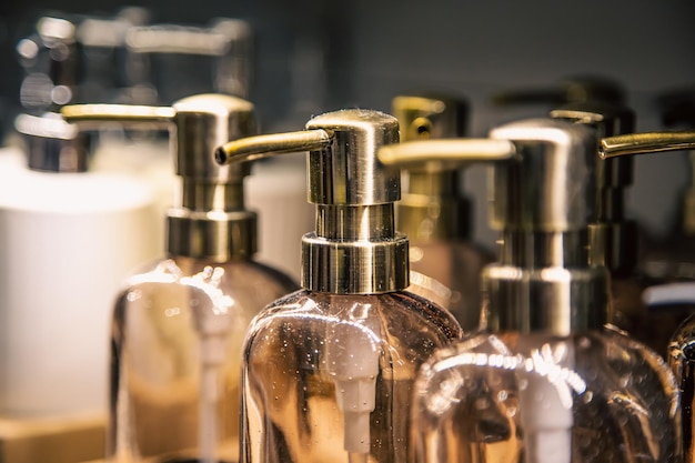 Closeup bottles with dispensers for liquid soap