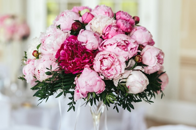 Closeup of bouquet made of white and pink peonies