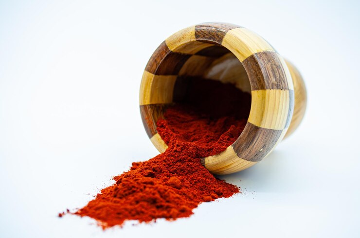 Free Photo closeup of a bowl of red pepper spice isolated on white background