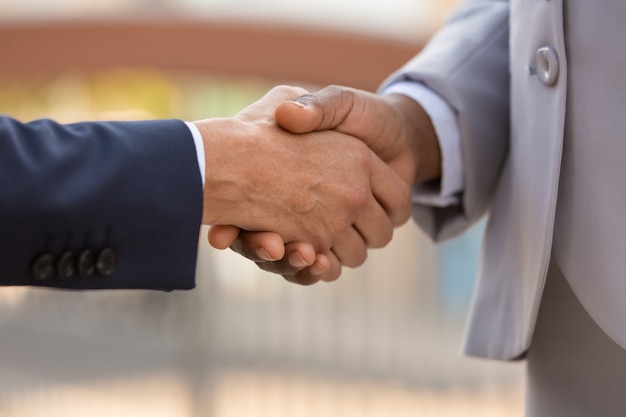 Closeup of business leaders handshake