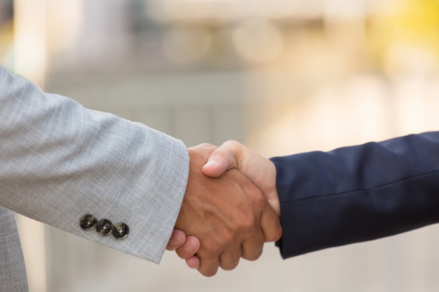 Closeup of business partners handshake
