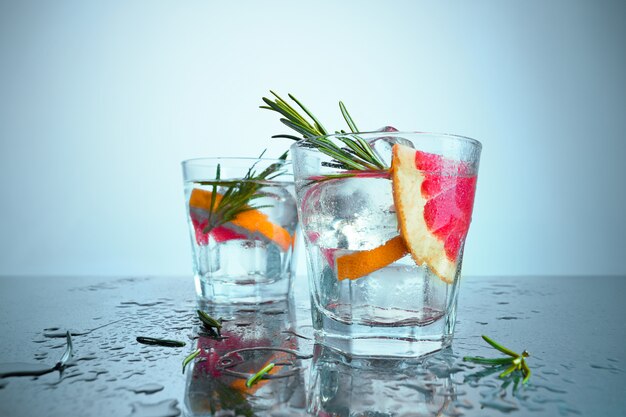 Closeup of a cape cod cocktail or vodka cranberry on a blue