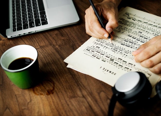 Closeup on casual man composing music