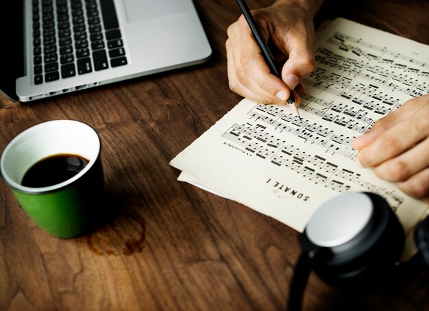 Closeup on casual man composing music