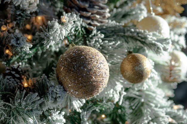 Closeup of Christmas decorations and lights on a Christmas tree