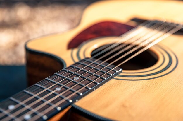 Closeup classical acoustic guitar soft focus in daylight