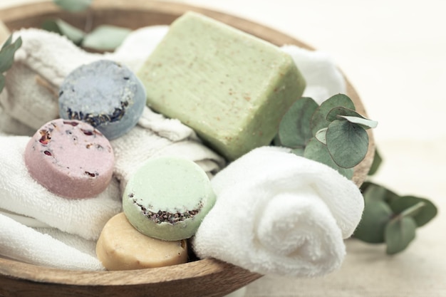 Free photo closeup colored handmade soap towel and eucalyptus